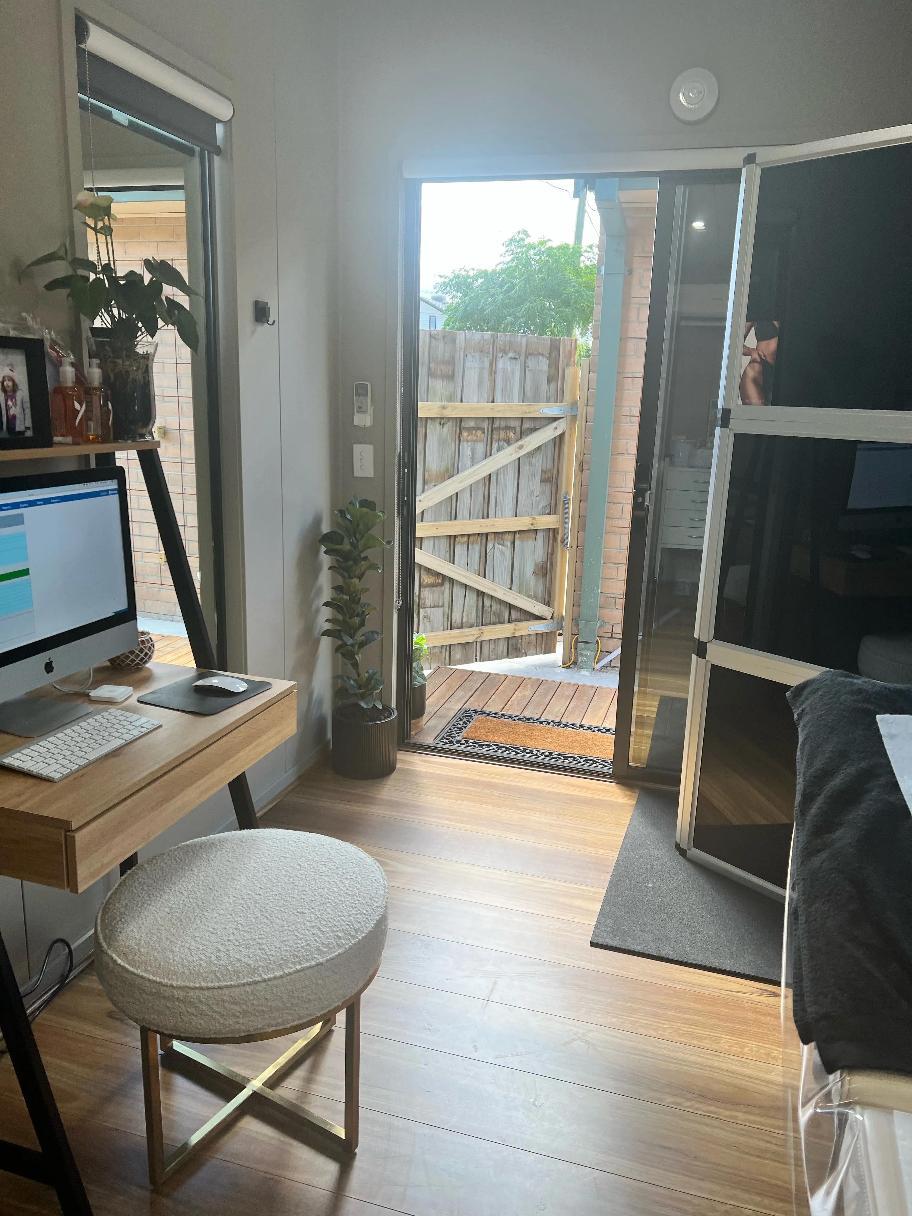 Studio interior looking out through the open door to the garden